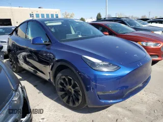 2023 Tesla Model Y Long Range with VIN 7SAYGAEE6PF689615, listed as a Copart auction lot 50999385 with 16,514 mi miles and Salvage Title. Bid and sale history available at DreamBid. Image 4.