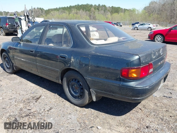 1995 Toyota Camry LE with VIN 4T1GK12E5SU860216, listed as a IAAI auction lot 41803933 with 235,130 mi miles. Bid and sale history available at carsss.com. Image 3.