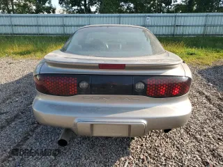 2000 Pontiac Firebird Firebird z VIN 2G2FS22K5Y2116520, wystawiony jako Copart lot #70697134 z przebiegiem 140 412 mil mil oraz Tytuł czysty. Historia ofert i sprzedaży dostępna na DreamBid. Obrazek 6.