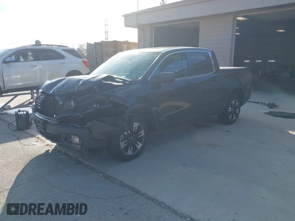 2020 Honda Ridgeline RTL with VIN 5FPYK3F59LB023212, listed as a IAAI auction lot 40704228 with 73,259 mi miles and . Bid and sale history available at DreamBid. Image 2.