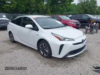 2021 Toyota Prius L Eco with VIN JTDKAMFU6M3137679, listed as a IAAI auction lot 42488129 with 52,414 mi miles and . Bid and sale history available at DreamBid. Image 1.
