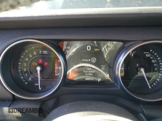 2023 Jeep Wrangler Sahara z VIN 1C4JJXP66PW605961, wystawiony jako Copart lot #50209655 z przebiegiem 32 805 mil mil oraz Szkoda całkowita • Salvage title. Historia ofert i sprzedaży dostępna na DreamBid. Obrazek 9.