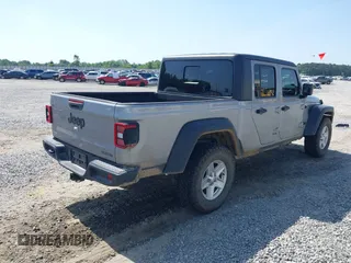 2020 Jeep Gladiator Sport S with VIN 1C6HJTAG7LL128940, listed as a IAAI auction lot 42108154 with 90,596 mi miles and . Bid and sale history available at DreamBid. Image 4.