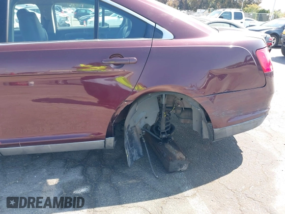 2011 Ford Taurus SEL with VIN 1FAHP2EW8BG137937, listed as a IAAI auction lot 42107586 with 143,525 mi miles. Bid and sale history available at carsss.com. Image 6.