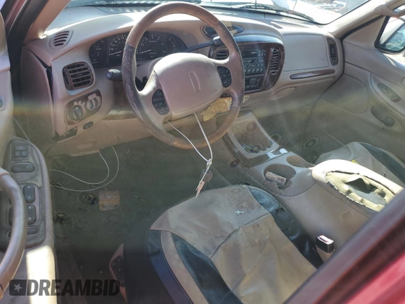 1999 Lincoln Navigator z VIN 5LMRU27A2XLJ41370, wystawiony jako Copart lot #72879004 z przebiegiem Nie podano mil oraz Szkoda całkowita • Salvage title. Historia ofert i sprzedaży dostępna na DreamBid. Obrazek 8.