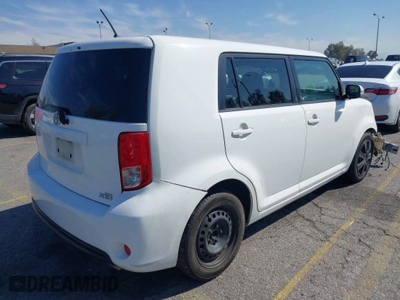 2014 Scion xB with VIN JTLZE4FE5EJ065953, listed as a IAAI auction lot 41850554 with 124,856 mi miles. Bid and sale history available at carsss.com. Image 4.