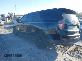2021 Chevrolet Suburban RST z VIN 1GNSCEKD2MR340613, wystawiony jako IAAI lot #41853016 z przebiegiem 77 498 mil mil oraz . Historia ofert i sprzedaży dostępna na DreamBid. Obrazek 3.