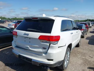 2014 Jeep Grand Cherokee Summit with VIN 1C4RJFJT3EC523129, listed as a IAAI auction lot 42341296 with 171,468 mi miles and . Bid and sale history available at DreamBid. Image 4.