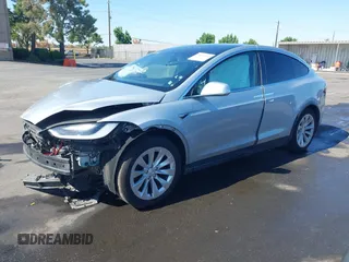 2016 Tesla Model X 70D with VIN 5YJXCAE21GF033123, listed as a IAAI auction lot 39813497 with 162,509 mi miles and . Bid and sale history available at DreamBid. Image 2.