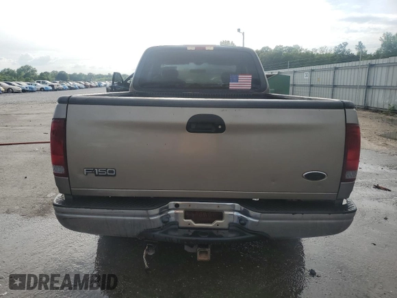 2003 Ford F-150 XL with VIN 1FTRX17LX3NA38576, listed as a Copart auction lot 54057495 with 173,811 mi miles and Salvage title. Bid and sale history available at DreamBid. Image 6.