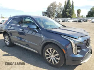 2019 Cadillac XT4 FWD Premium Luxury with VIN 1GYFZCR42KF104457, listed as a Copart auction lot 52783485 with 57,572 mi miles and Salvage title. Bid and sale history available at DreamBid. Image 4.