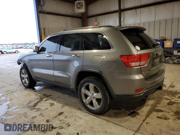 2013 Jeep Grand Cherokee Overland with VIN 1C4RJFCT5DC599866, listed as a Copart auction lot 51837395 with 105,521 mi miles and Salvage Title. Bid and sale history available at carsss.com. Image 2.