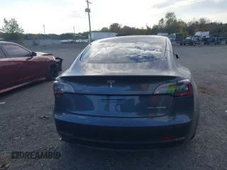 2021 Tesla Model 3 Long Range with VIN 5YJ3E1EB6MF975916, listed as a IAAI auction lot 40713749 with 29,593 mi miles and . Bid and sale history available at DreamBid. Image 15.
