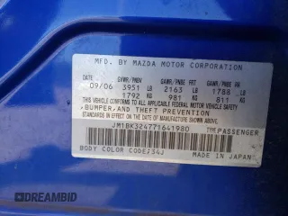 2007 Mazda 3 S Touring with VIN JM1BK324771641980, listed as a Copart auction lot 61132664 with 121,518 mi miles and Salvage Title. Bid and sale history available at DreamBid. Image 12.
