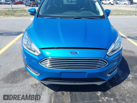 2015 Ford Focus Titanium with VIN 1FADP3J24FL322247, listed as a IAAI auction lot 41998030 with 151,341 mi miles and . Bid and sale history available at carsss.com. Image 6.