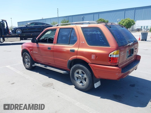 1999 Isuzu Rodeo S z VIN 4S2CK58WXX4346156, wystawiony jako IAAI lot #42328951 z przebiegiem 196 182 mil mil oraz . Historia ofert i sprzedaży dostępna na DreamBid. Obrazek 3.