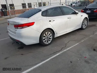 2016 Kia Optima EX with VIN 5XXGU4L38GG008436, listed as a IAAI auction lot 42094498 with 134,781 mi miles. Bid and sale history available at carsss.com. Image 4.