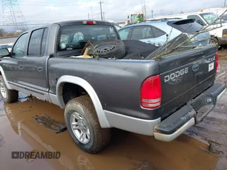 2002 Dodge Dakota SLT z VIN 1B7HG48N32S634478, wystawiony jako IAAI lot #41485500 z przebiegiem 166 082 mil mil oraz . Historia ofert i sprzedaży dostępna na DreamBid. Obrazek 3.