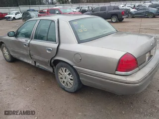 2005 Ford Crown Victoria LX with VIN 2FAFP74W05X174758, listed as a IAAI auction lot 41553606 with 192,103 mi miles. Bid and sale history available at carsss.com. Image 3.