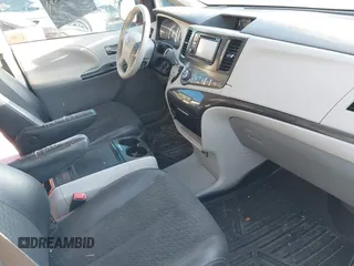 2014 Toyota Sienna SE with VIN 5TDXK3DC1ES462473, listed as a IAAI auction lot 41811437 with 209,704 mi miles and . Bid and sale history available at DreamBid. Image 5.