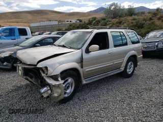 1998 Infiniti QX4 with VIN JNRAR05Y1WW037024, listed as a Copart auction lot 77421234 with 178,785 mi miles and Salvage Title. Bid and sale history available at DreamBid. Image 1.