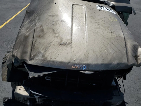 2005 Jeep Grand Cherokee Laredo z VIN 1J4HR48N65C517657, wystawiony jako Copart lot #58774685 z przebiegiem Nie podano mil oraz Szkoda całkowita • Salvage title. Historia ofert i sprzedaży dostępna na DreamBid. Obrazek 12.