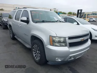 2010 Chevrolet Suburban LT with VIN 1GNUCJE03AR238548, listed as a IAAI auction lot 42104596 with 153,959 mi miles. Bid and sale history available at carsss.com. Image 1.