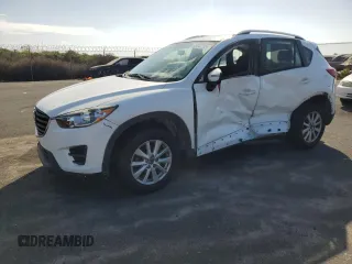 2016 Mazda CX-5 Sport z VIN JM3KE2BY0G0874729, wystawiony jako Copart lot #45242795 z przebiegiem 70 741 mil mil oraz Czysty tytuł • Clean title. Historia ofert i sprzedaży dostępna na DreamBid. Obrazek 1.
