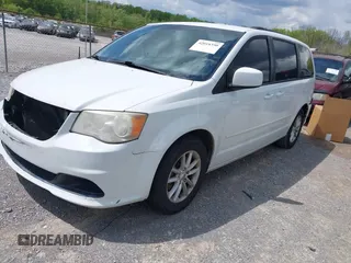 2014 Dodge Grand Caravan SXT with VIN 2C4RDGCG8ER264027, listed as a IAAI auction lot 42018350 with 311,876 mi miles and . Bid and sale history available at DreamBid. Image 2.