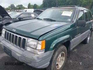 1996 Jeep Grand Cherokee with VIN 1J4EZ58Y7TC128302, listed as a IAAI auction lot 42643449 with 282,036 mi miles and . Bid and sale history available at DreamBid. Image 6.