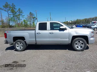 2018 Chevrolet Silverado 1500 LT with VIN 1GCVKREC9JZ335603, listed as a IAAI auction lot 41853399 with 152,460 mi miles and . Bid and sale history available at DreamBid. Image 13.