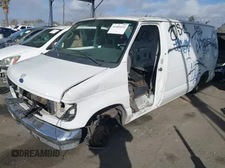 2001 Ford Econoline Cargo with VIN 1FTRE14281HA77986, listed as a IAAI auction lot 41493232 with 151,753 mi miles and . Bid and sale history available at DreamBid. Image 2.