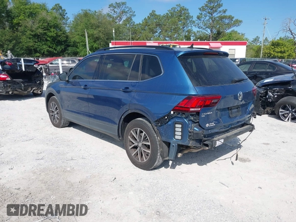 2019 Volkswagen Tiguan SE with VIN 3VV3B7AX2KM006055, listed as a IAAI auction lot 42023713 with 83,570 mi miles and . Bid and sale history available at DreamBid. Image 3.