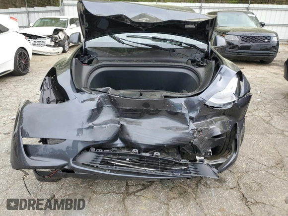 2024 Tesla Model Y Long Range z VIN 7SAYGDEE9RA293776, wystawiony jako Copart lot #51289225 z przebiegiem 12 990 mil mil oraz Szkoda całkowita • Salvage title. Historia ofert i sprzedaży dostępna na DreamBid. Obrazek 5.