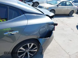 2016 Nissan Maxima SR with VIN 1N4AA6AP9GC414943, listed as a IAAI auction lot 41976295 with 154,738 mi miles and . Bid and sale history available at DreamBid. Image 6.