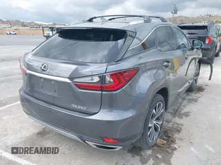 2020 Lexus RX with VIN 2T2HZMAA3LC153100, listed as a IAAI auction lot 41925188 with 104,216 mi miles. Bid and sale history available at carsss.com. Image 4.