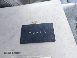 2024 Tesla Model Y Long Range with VIN 7SAYGDEE2RA318579, listed as a IAAI auction lot 41911015 with 9,277 mi miles. Bid and sale history available at carsss.com. Image 11.