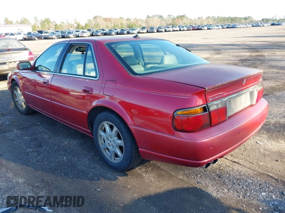 2003 Cadillac Seville Touring STS z VIN 1G6KY54983U212944, wystawiony jako IAAI lot #41656796 z przebiegiem 118 662 mil mil oraz . Historia ofert i sprzedaży dostępna na DreamBid. Obrazek 3.