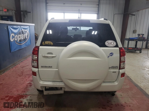 2006 Suzuki Grand Vitara Premium z VIN JS3TD943164101223, wystawiony jako Copart lot #43979705 z przebiegiem 147 813 mil mil oraz Czysty tytuł • Clean title. Historia ofert i sprzedaży dostępna na DreamBid. Obrazek 6.