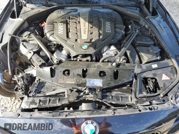 2013 BMW 5 Series 550i xDrive z VIN WBAFU9C59DDY72859, wystawiony jako Copart lot #56211465 z przebiegiem 98 620 mil mil oraz Szkoda całkowita • Salvage title. Historia ofert i sprzedaży dostępna na DreamBid. Obrazek 11.