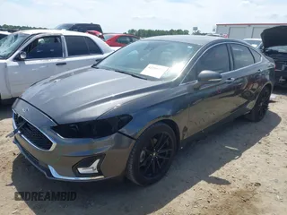 2019 Ford Fusion Titanium with VIN 3FA6P0D9XKR152617, listed as a IAAI auction lot 42209470 with 135,956 mi miles and . Bid and sale history available at DreamBid. Image 2.