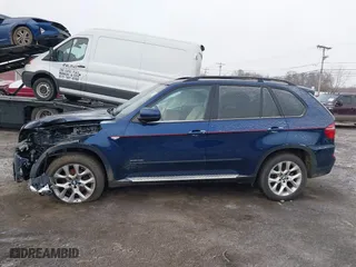 2011 BMW X5 35i with VIN 5UXZV4C54BL738262, listed as a IAAI auction lot 41633474 with 173,914 mi miles. Bid and sale history available at carsss.com. Image 14.
