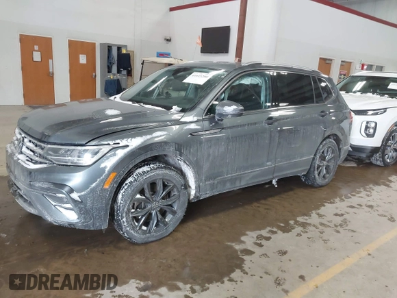 2023 Volkswagen Tiguan SE with VIN 3VVMB7AX5PM013447, listed as a IAAI auction lot 41615200 with 66,259 mi miles and . Bid and sale history available at DreamBid. Image 2.