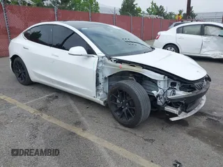 2020 Tesla Model 3 Standard Range Plus with VIN 5YJ3E1EA0LF803984, listed as a IAAI auction lot 42161154 with 53,322 mi miles. Bid and sale history available at carsss.com. Image 1.