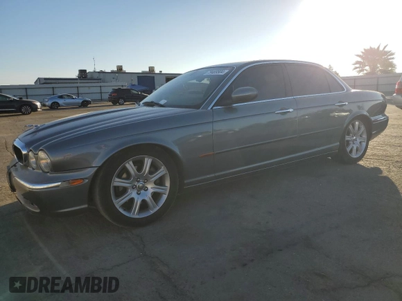 2004 Jaguar XJ with VIN SAJWA71C74SG20299, listed as a Copart auction lot 79469504 with 78,134 mi miles and Salvage Title. Bid and sale history available at carsss.com. Image 1.
