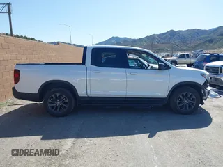 2023 Honda Ridgeline Sport z VIN 5FPYK3F13PB060341, wystawiony jako IAAI lot #41955592 z przebiegiem 27 927 mil mil oraz . Historia ofert i sprzedaży dostępna na DreamBid. Obrazek 14.