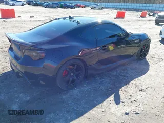 2014 Scion FR-S z VIN JF1ZNAA14E9708590, wystawiony jako IAAI lot #41278089 z przebiegiem 117 357 mil mil oraz . Historia ofert i sprzedaży dostępna na DreamBid. Obrazek 4.