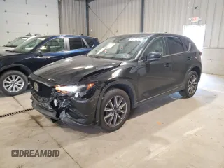 2018 Mazda CX-5 Touring z VIN JM3KFACMXJ1301468, wystawiony jako Copart lot #57320265 z przebiegiem 129 576 mil mil oraz Szkoda całkowita • Salvage title. Historia ofert i sprzedaży dostępna na DreamBid. Obrazek 1.
