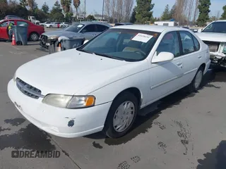 1998 Nissan Altima XE with VIN 1N4DL01D8WC165818, listed as a IAAI auction lot 41658156 with 184,843 mi miles. Bid and sale history available at carsss.com. Image 2.