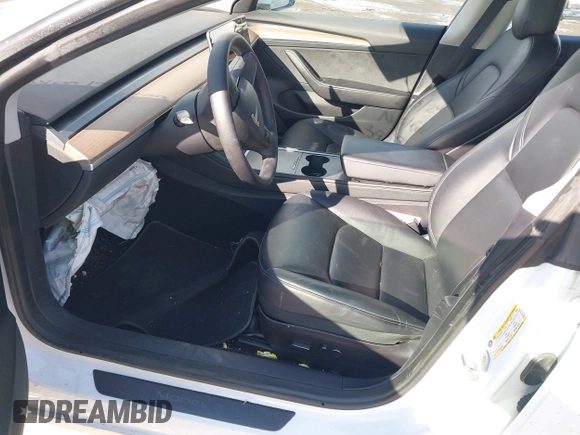 2023 Tesla Model 3 Long Range with VIN 5YJ3E1EBXPF392818, listed as a IAAI auction lot 41346835 with 31,750 mi miles and . Bid and sale history available at DreamBid. Image 5.